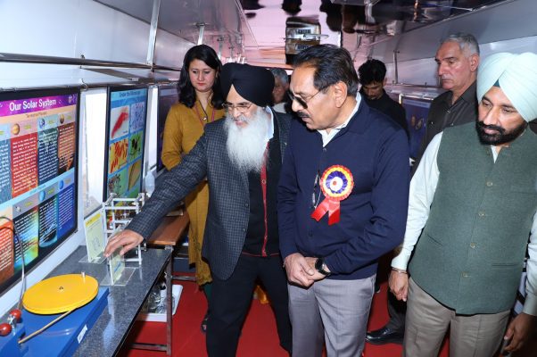 Men walking in Mobile Science Bus