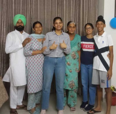 Topper Amanat Kaur with family