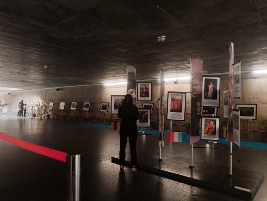 visitors wander through the exhibition of Wattas' Photographs